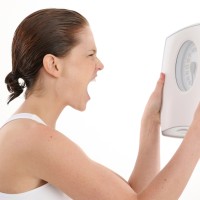 woman holding scale